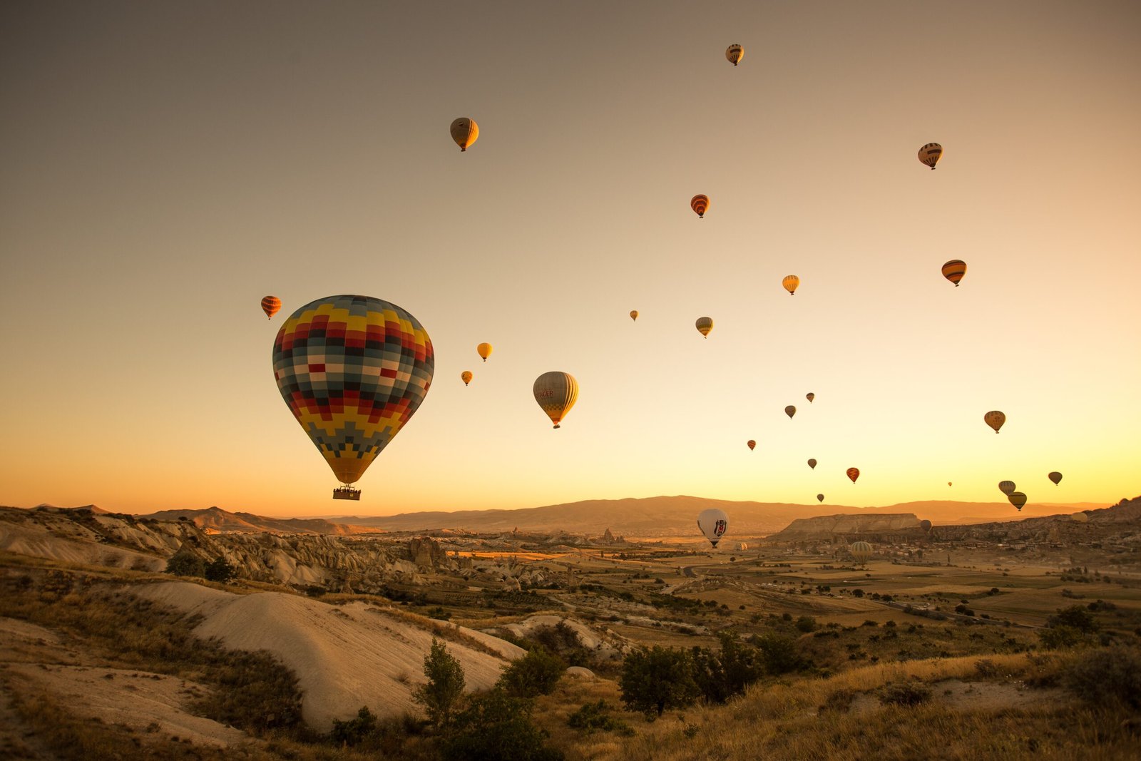 Set of colored balloons flying above the ground in Cappadocia, Turkey Set of colored balloons flying above the ground in Cappadocia, Turkey